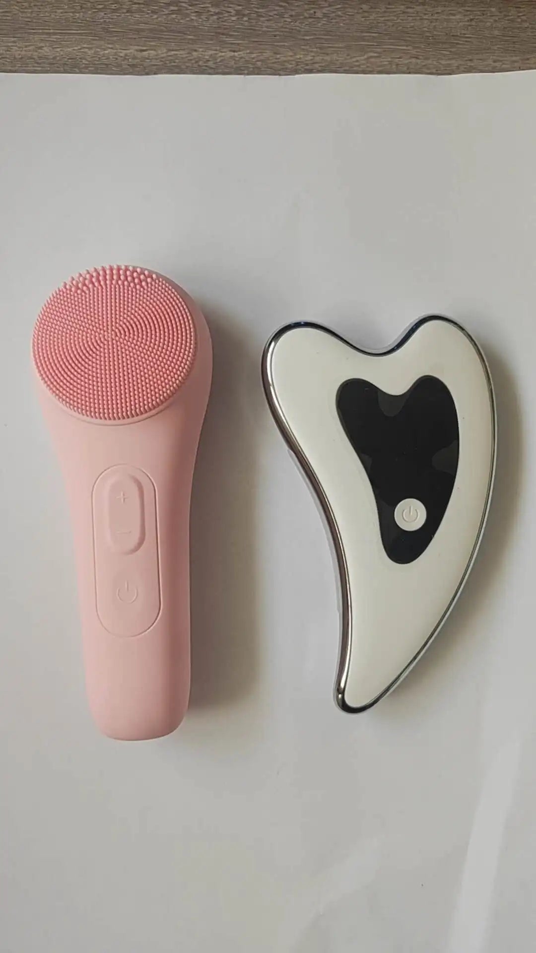 Gua sha facial massager. Four-mode facial sculpting tool with heat therapy, red and blue light therapy.